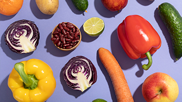 Photo of vegetables taken against lavender backdrop