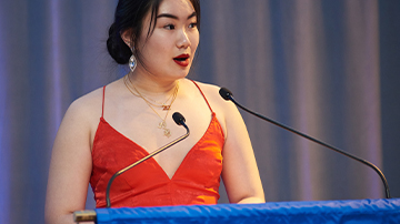 student speaking at FIT leadership gala