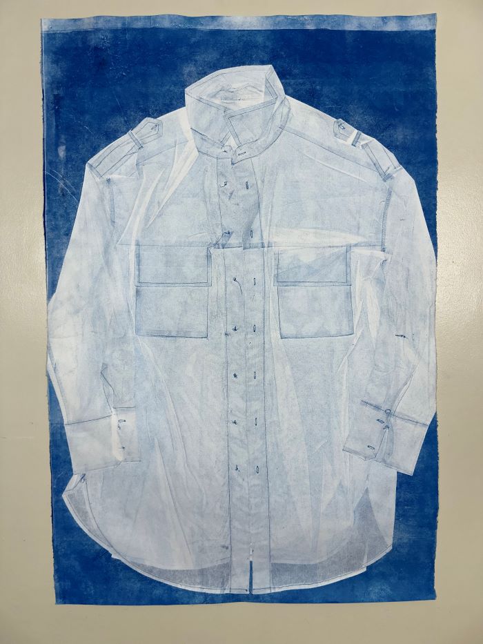 a fabric print of a white shirt on a blue background