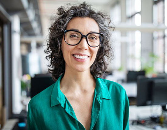 Closeup of a student standing and smiling