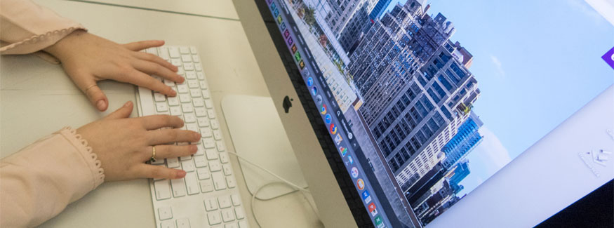 hands laying on top of computer keyboard