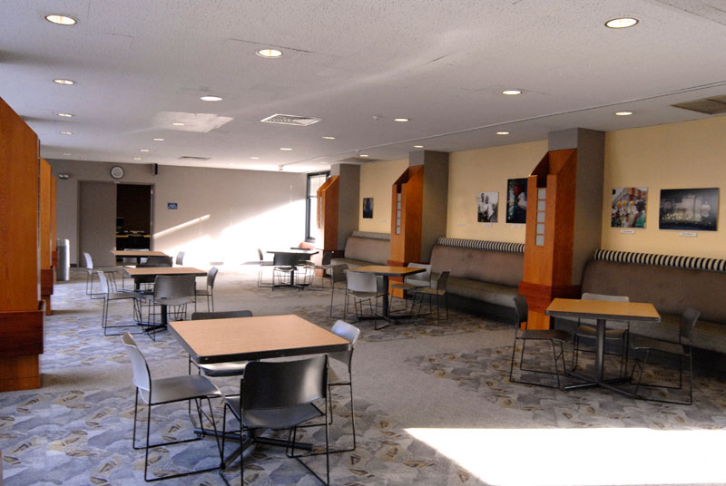8th floor common area with tables and chairs