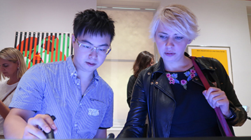 graduate students in the exhibition hall at FIT