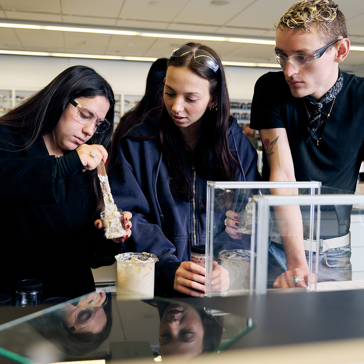 FIT students mixing ingrediends in Cosmetic and Fragrance Marketing class