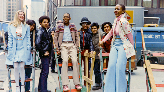 Smith, with his crew and sister Toukie Smith (far right), in an image included in Black in Fashion. Blazio-Licorish says, “That picture is everything that people imagine fashion to be.”