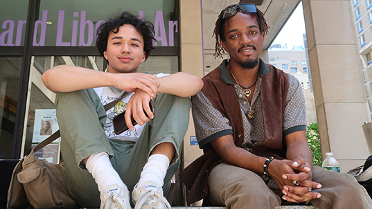 FIT students sitting outdoors on campus