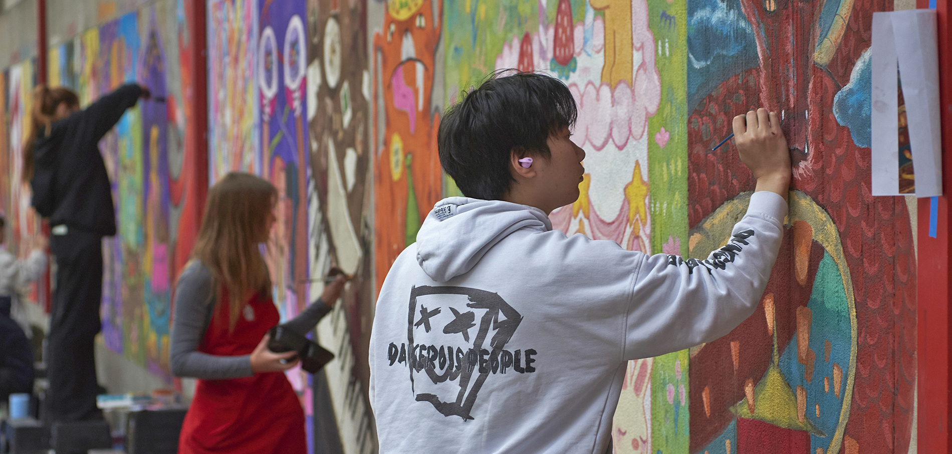 Illustration BFA students paint murals on campus walls for ChalkFIT