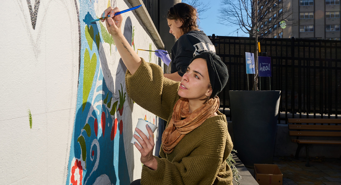 FIT Illustration MFA students painting mural outside Queens Hospital