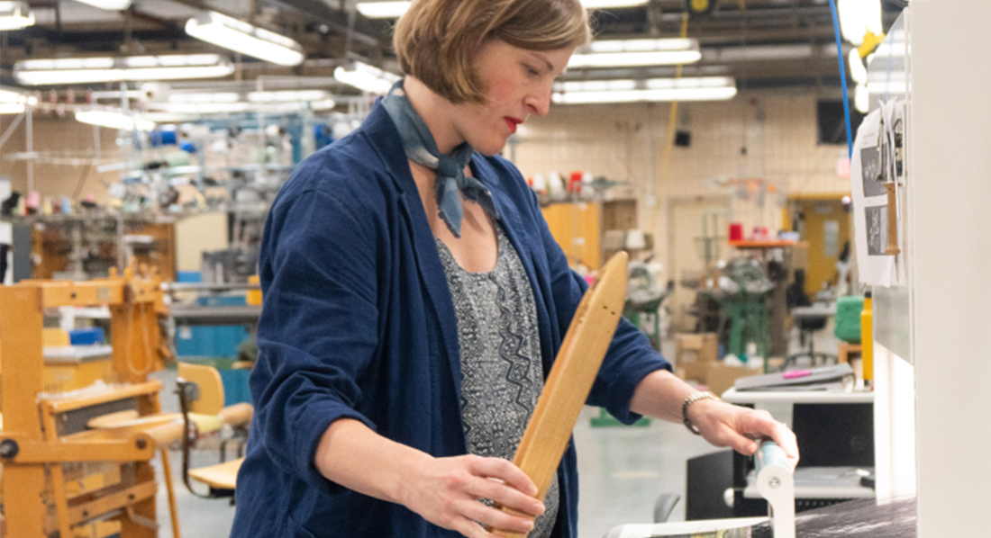 Professor Whiteny Crutchfield uses FIT's new jacquard loom, the TC2