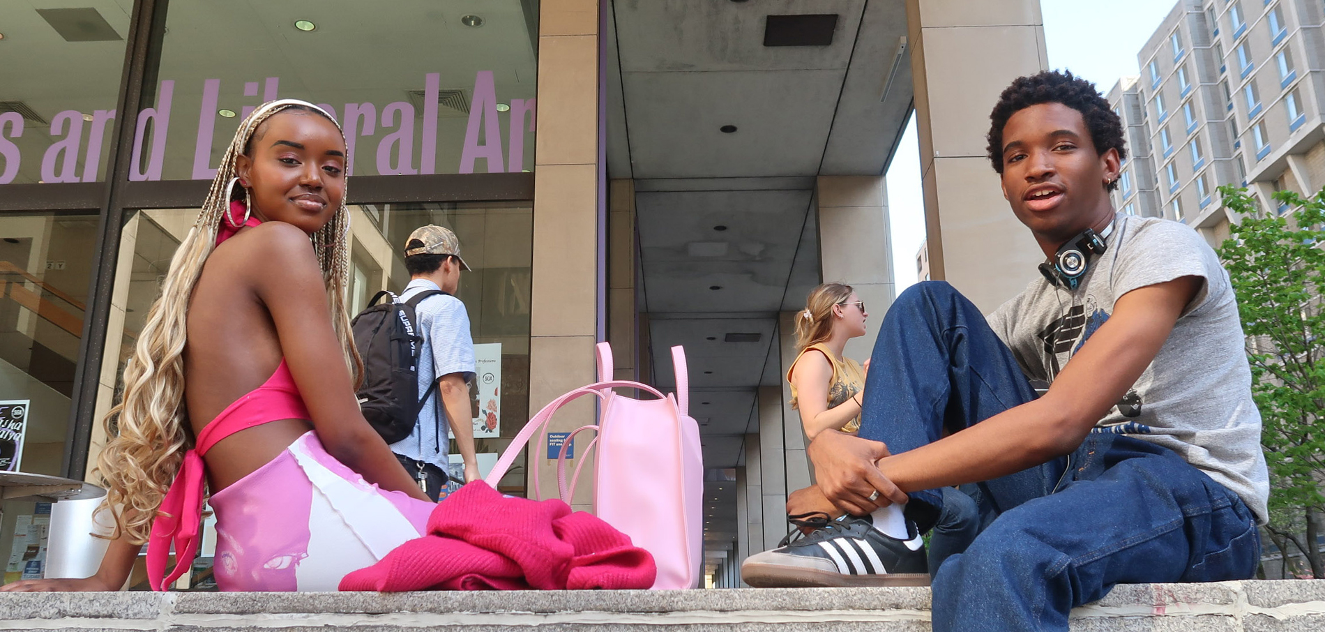 two students sitting utdoors on FIT campus