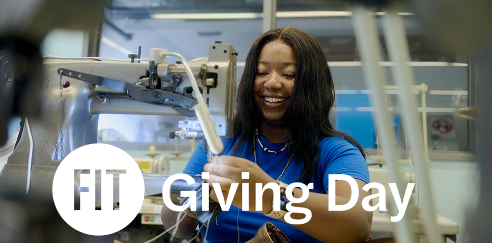 Student in campus lab with giving day logo on top