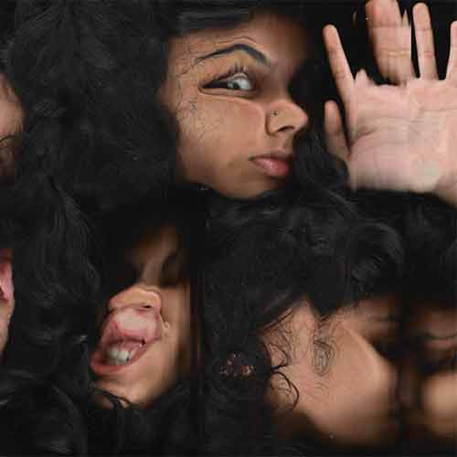 women pressed up against glass