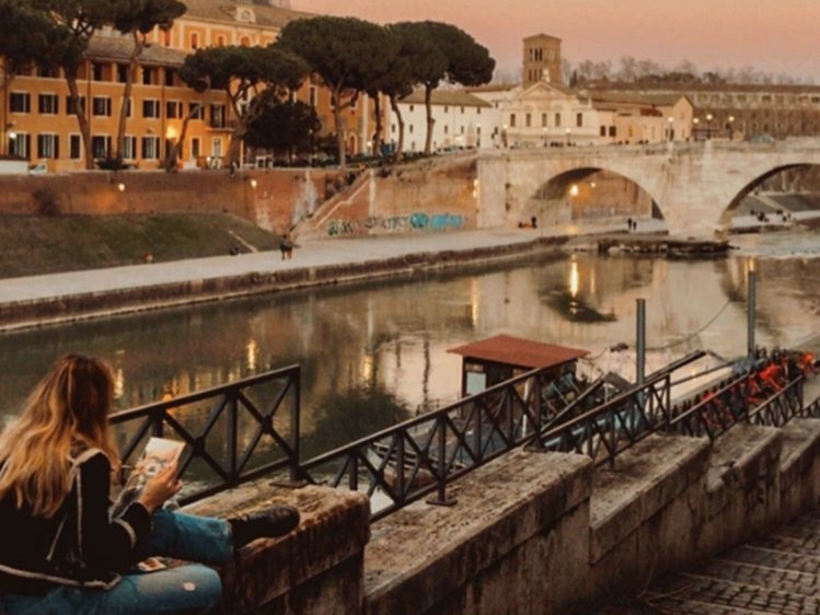 Student working along the river in Florence