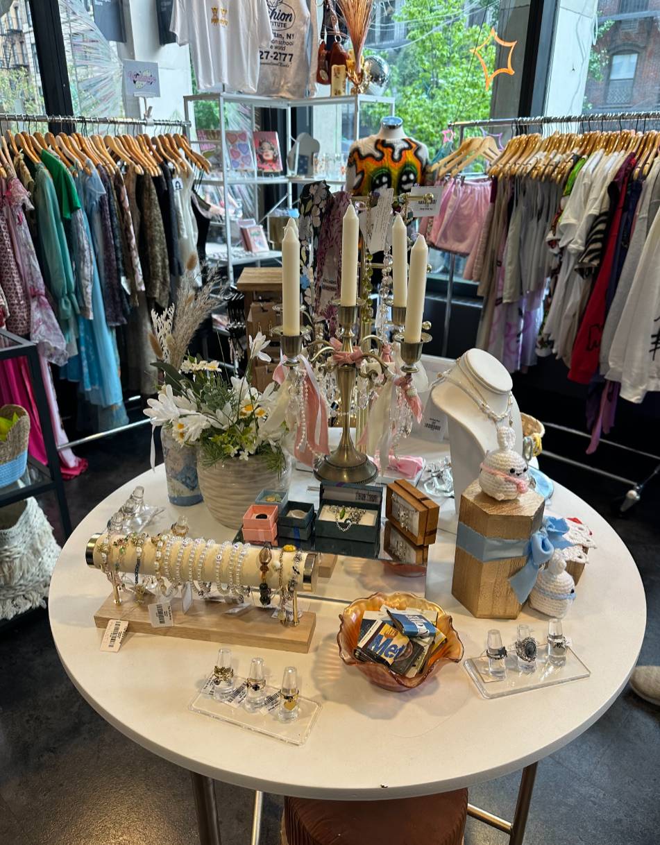 style shop interior with clothing racks and arranged items on tables