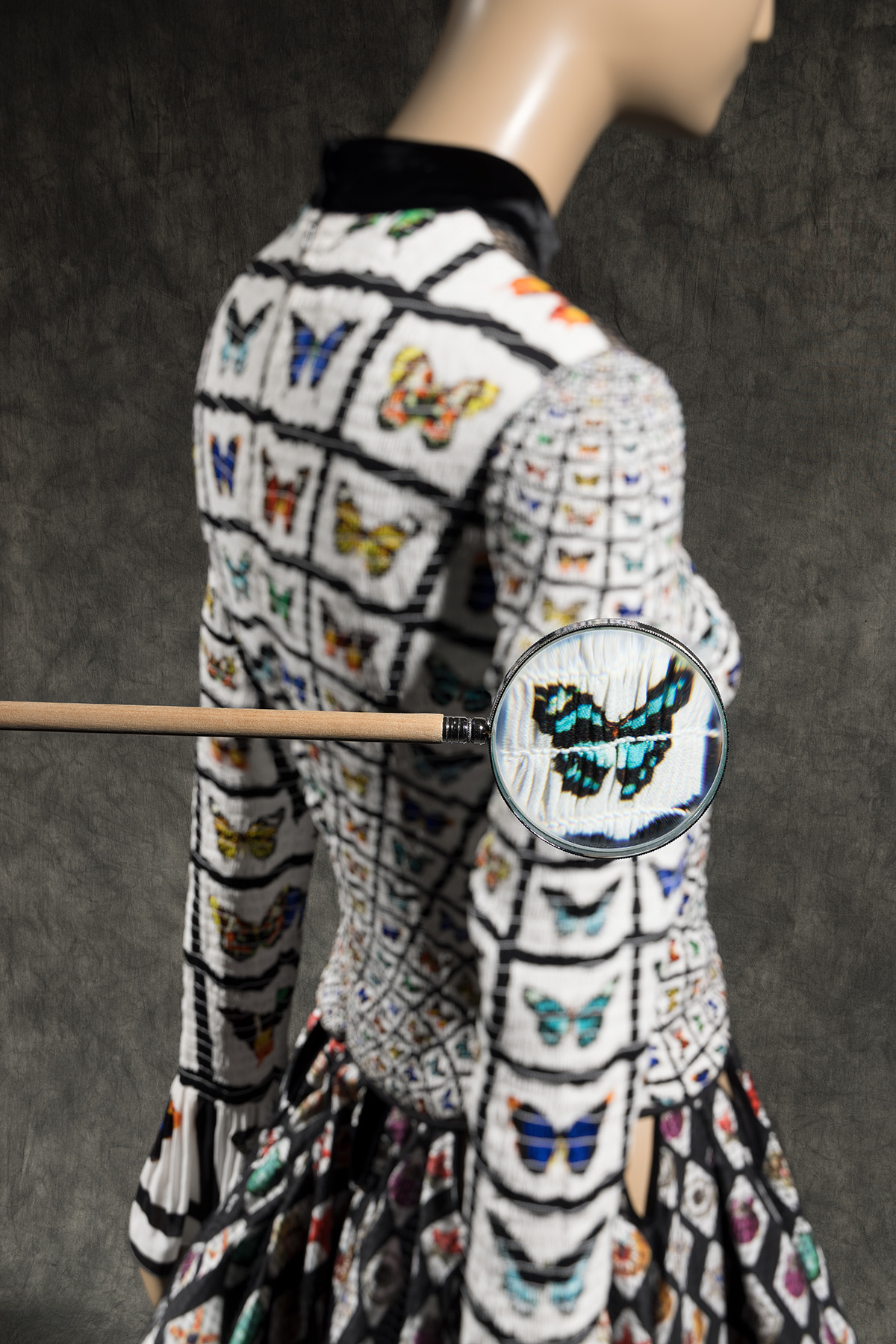 white, long sleeved dress with printed butterflies and seashells