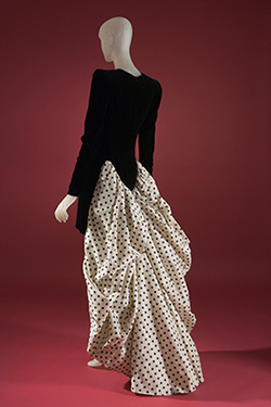 Carolina Herrera, cocktail dress, fall 1988, USA. long sleeved, black velvet dress with form fitting bodice, and white and black polka dot train