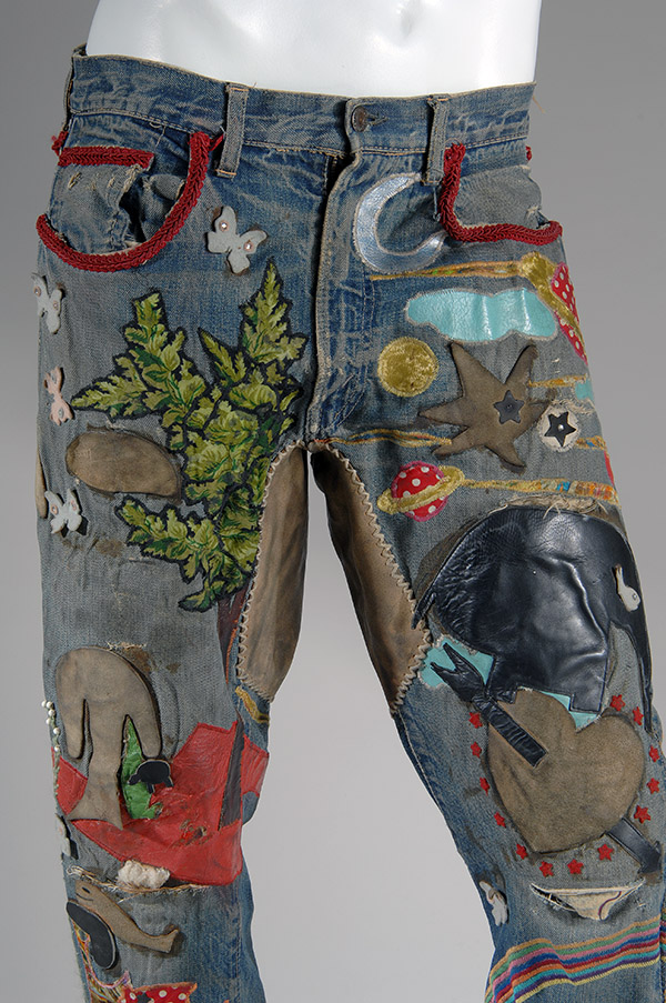embellished jeans with multicolor overall applique, beadwork, embroidery incorporating leather, vinyl, contrast fabric, rhinestones and cord
