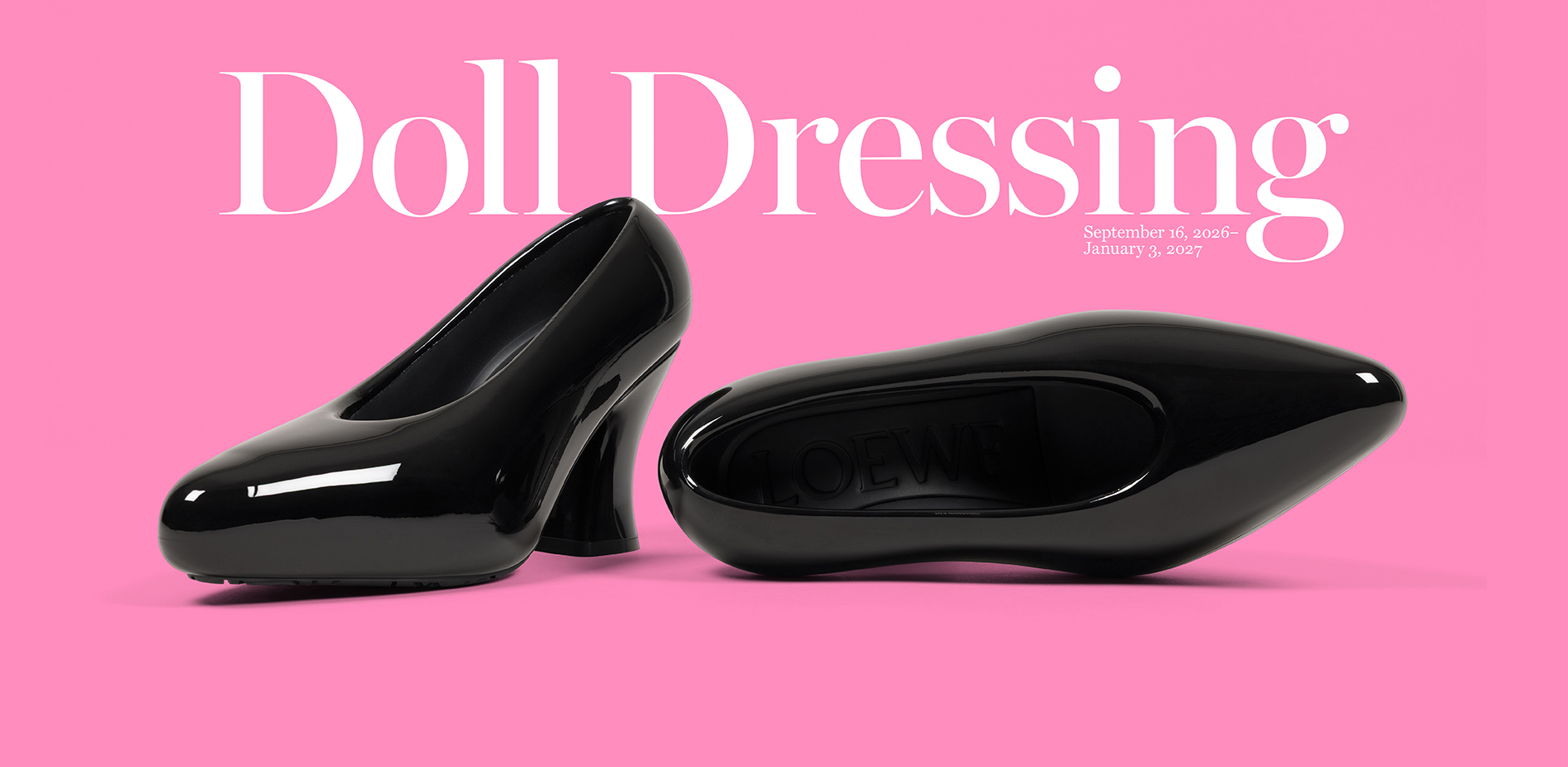 two glossy black patent leather pumps with sculptural heels on a pink background, one shoe upright and one lying on its side showing the LOEWE branded sole
