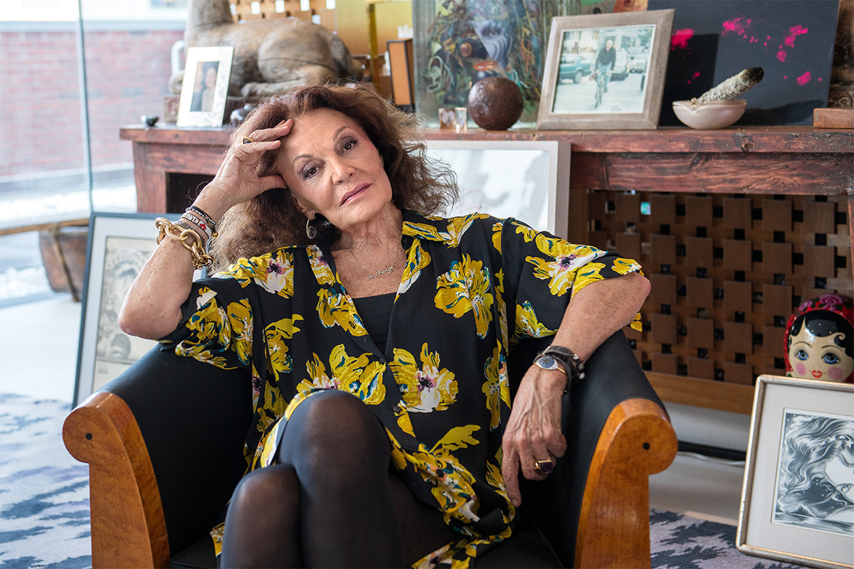 Diane von Furstenberg sitting in a chair