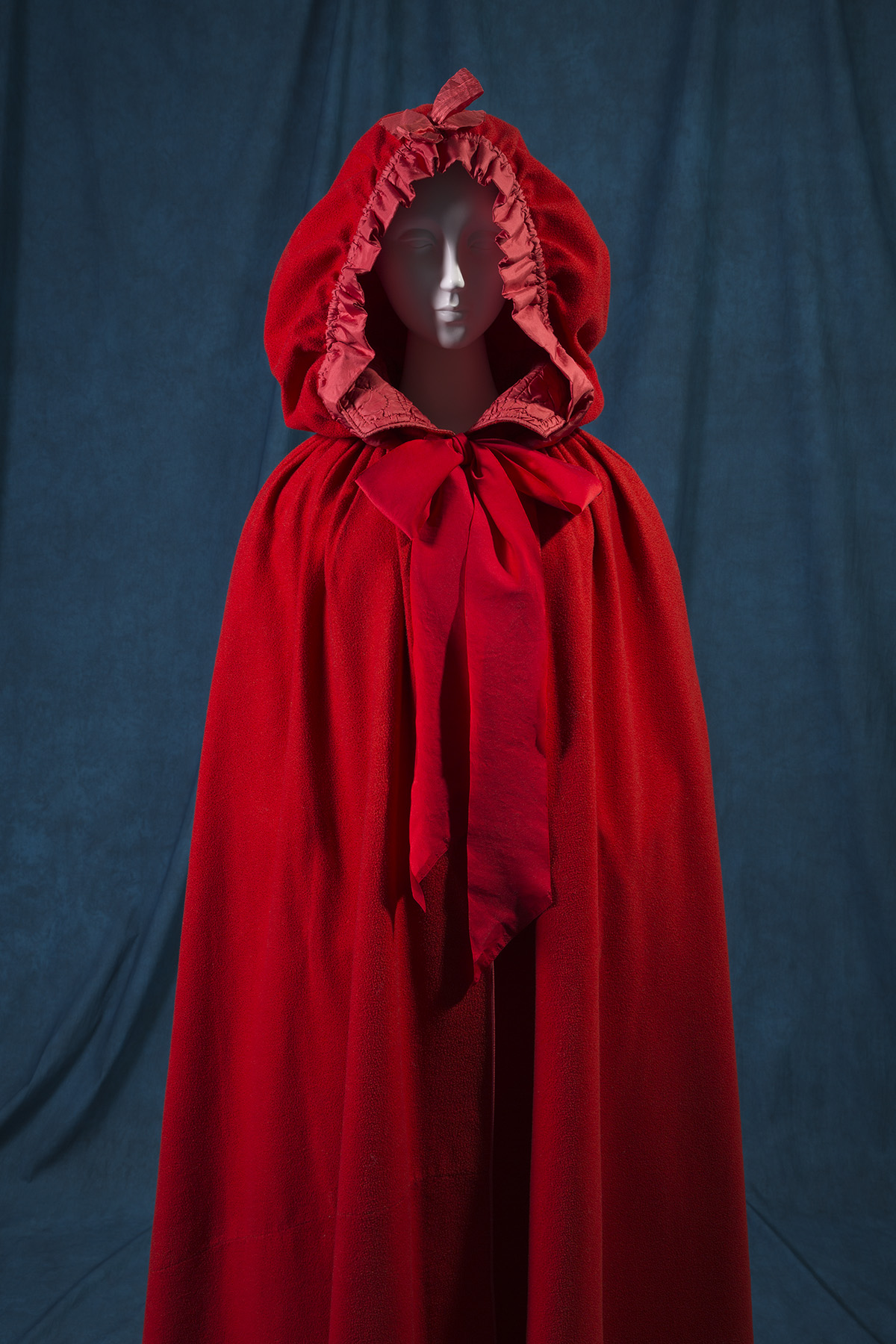 long cape in bright red with attached hood and neckline ties