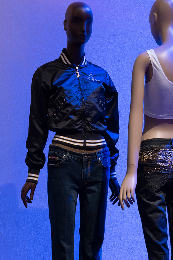 Black satin bomber jacket with stripped collar and waistband styled with denim jeans