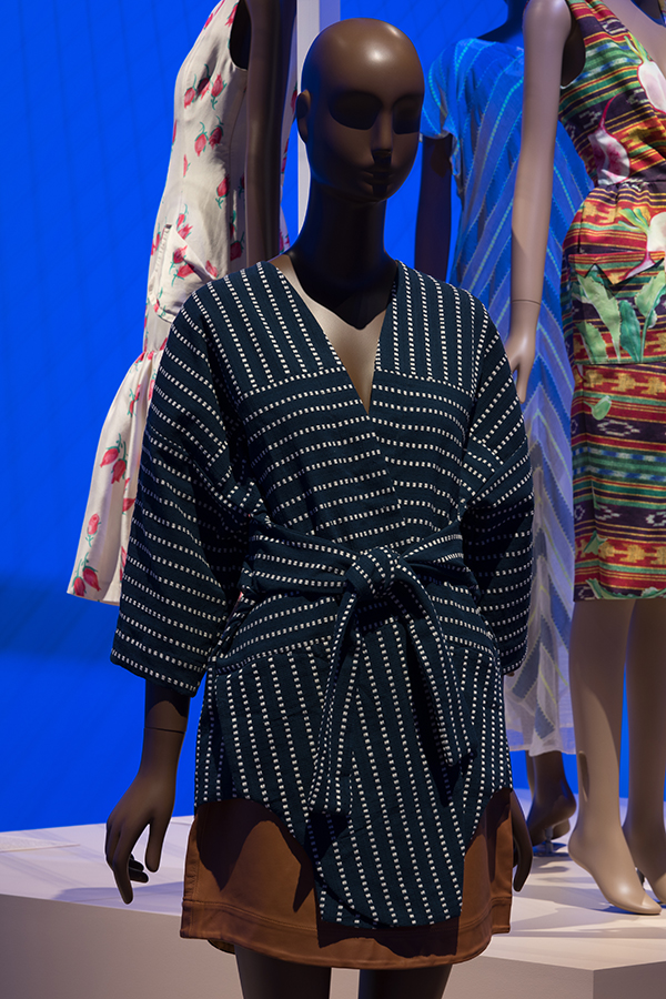 Short, navy blue kimono with dotted stripes and tie belt and tan leather mini skirt
