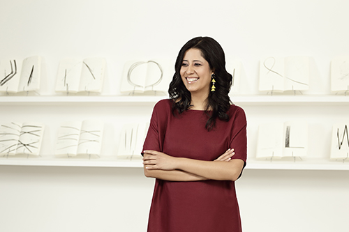 Tanya Melendez-Escalante standing with arms folded